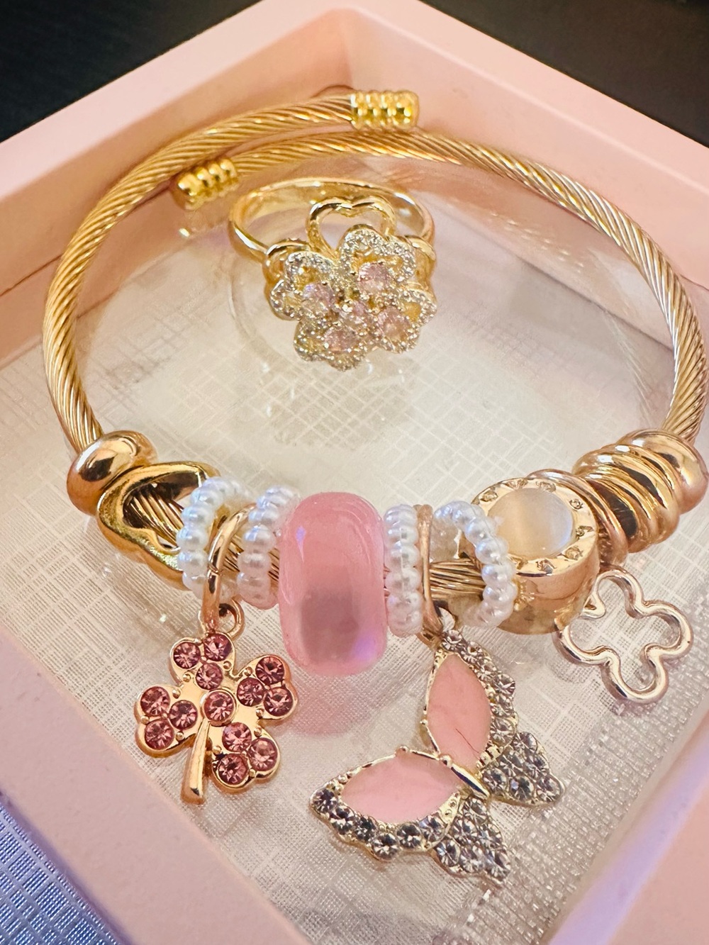 Gold-Tone Women's Charm Bangle Bracelet with Pink Accents with a flower ring